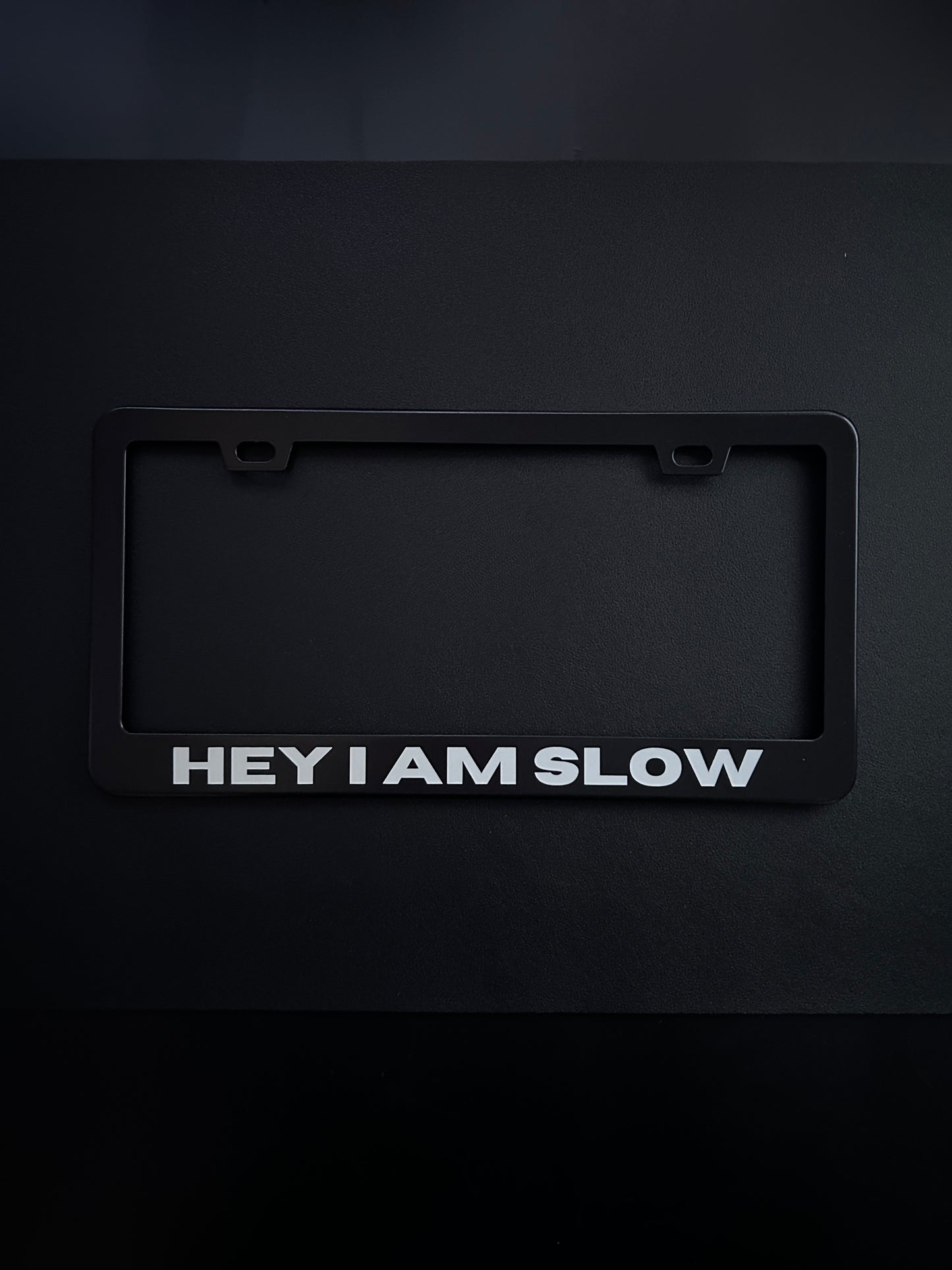 Hey I Am Slow Black Stainless Steel License Plate Frame