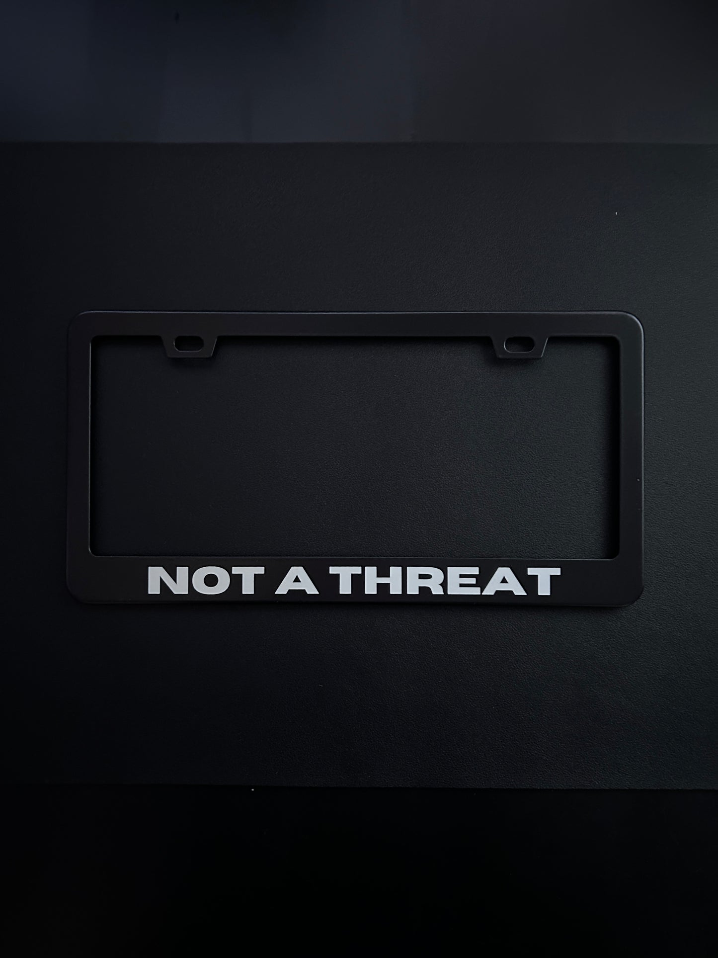Not a Threat Black Stainless Steel License Plate Frame