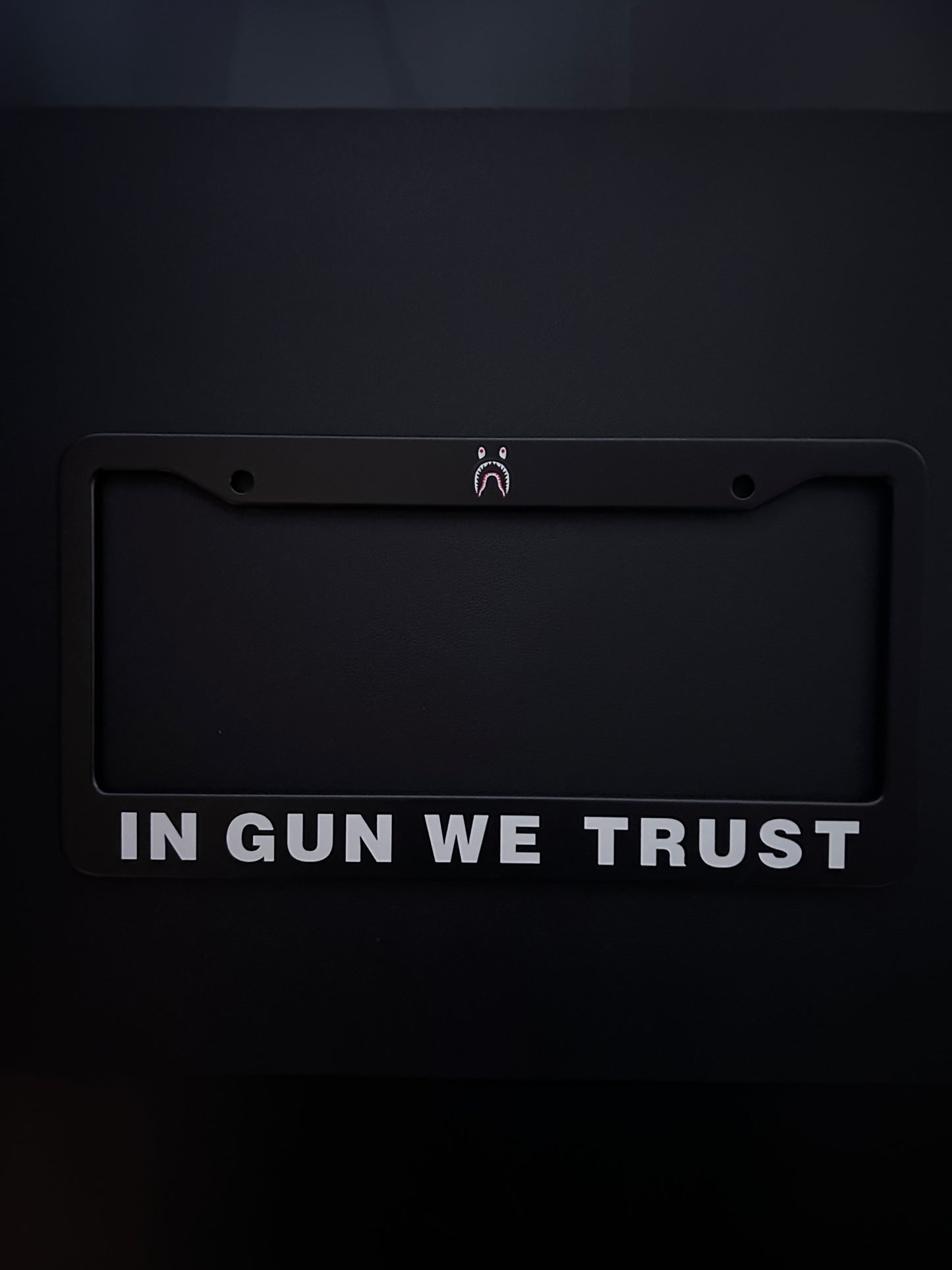 In Gun We Trust Black Stainless Steel License Plate Frame